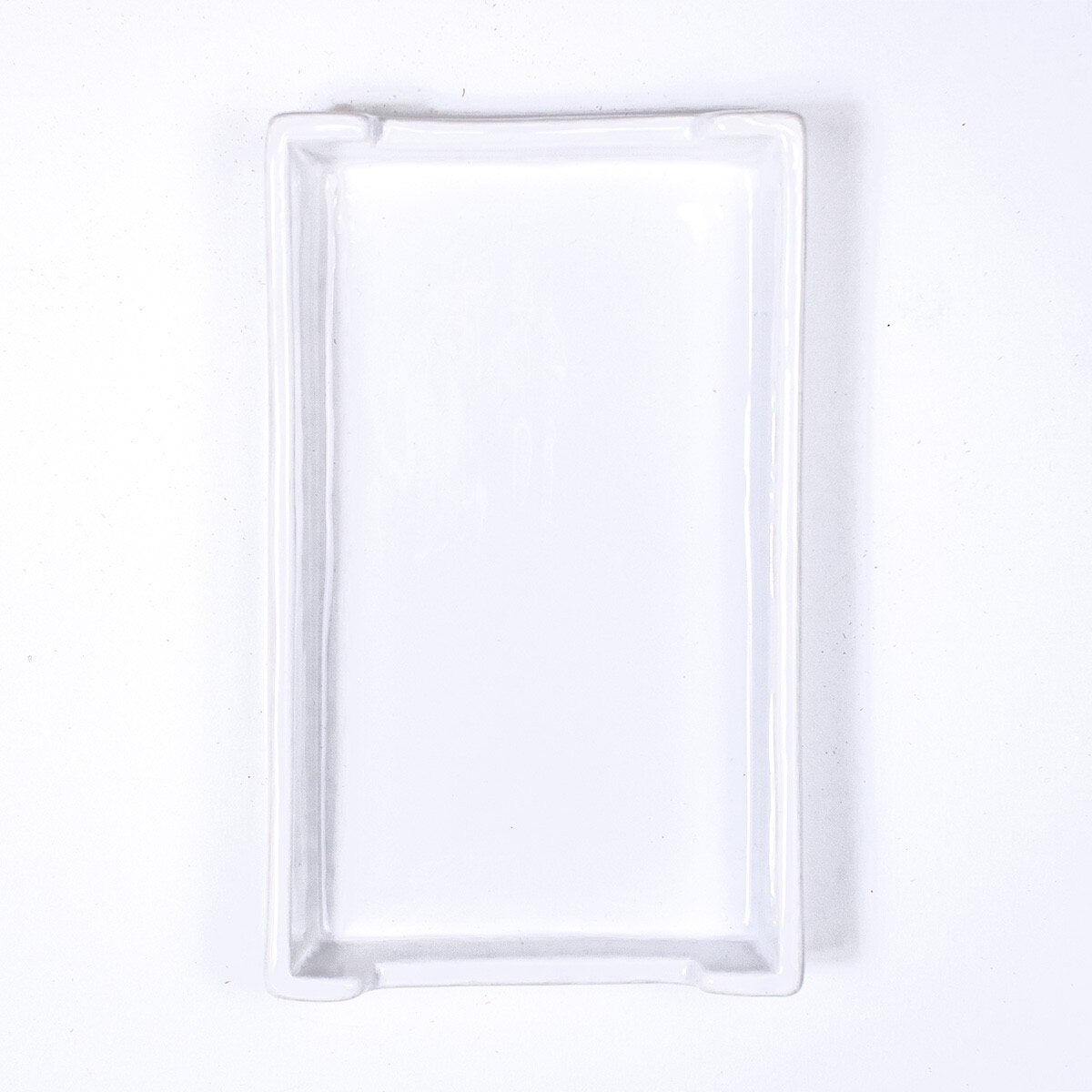 Rectangular white ceramic tray with raised edges
