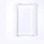 Ceramic rectangular white tray featuring raised, slightly rounded edges and a clean minimalist aesthetic