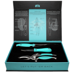 Toadfish product photography of an open black and teal box presenting a three-piece seafood toolset with vibrant teal handles including an oyster knife, shrimp cleaner, and crab cutter, resting on a black velvet insert, with the lid featuring illustrative diagrams and the box front declaring "LET'S PUT 'EM BACK"
