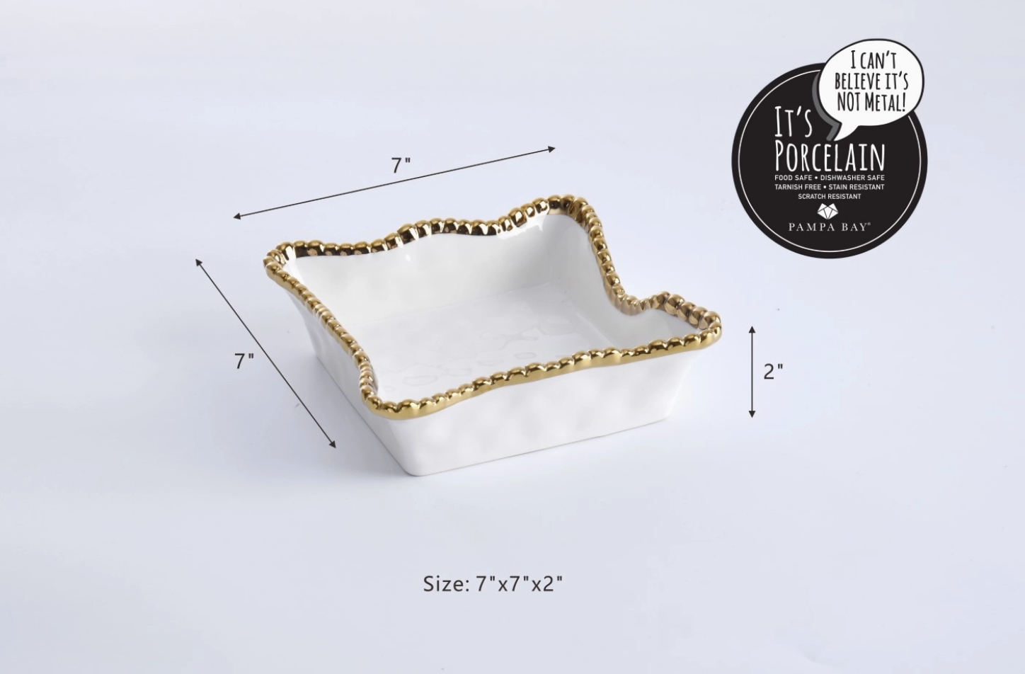 White porcelain square bowl by Pampa Bay featuring a gold beaded rim and wavy organic edges against a white background with 7x7x2 inch dimension lines and a black Pampa Bay brand seal