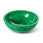 Green polished malachite bowl showcasing a mottled texture and bright reflections