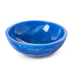 Handcrafted resin bowl with vibrant deep blue and white swirling patterns reminiscent of ocean waves and a glossy reflective surface
