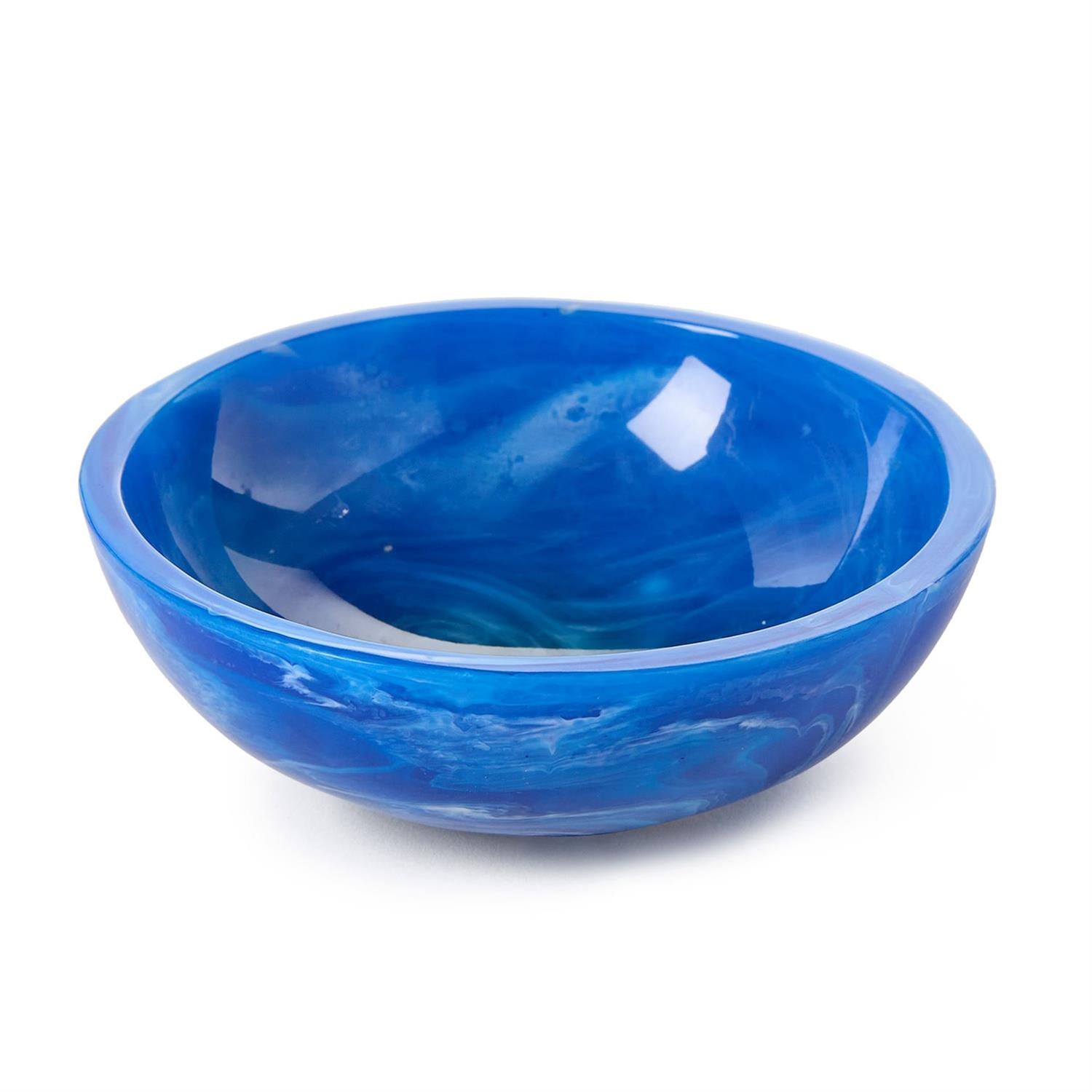 Handcrafted resin bowl with vibrant deep blue and white swirling patterns reminiscent of ocean waves and a glossy reflective surface