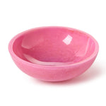 A glossy pink decorative bowl featuring subtle light reflections and white marble-like swirling patterns on a white background