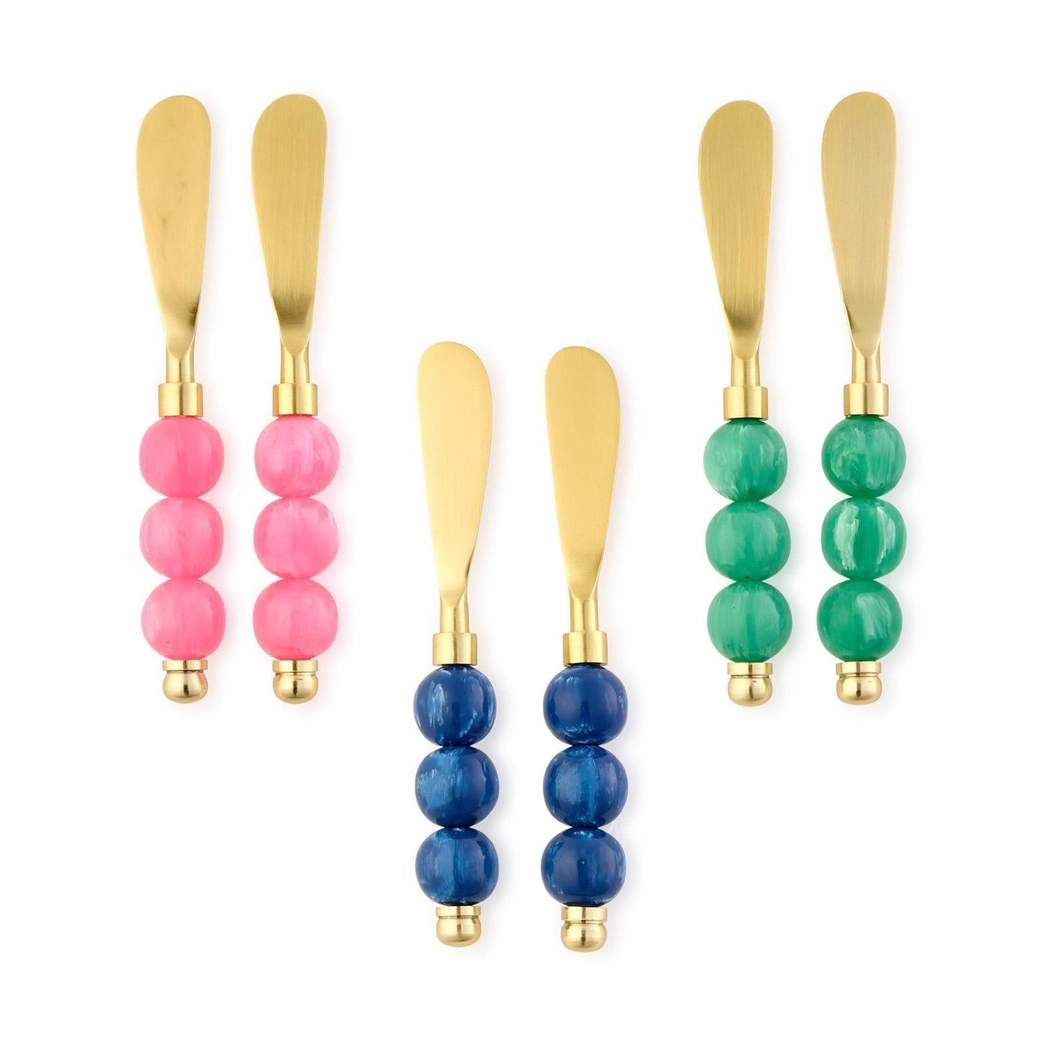 Six modern cheese or butter spreading knives with brushed gold blades and distinct stacked spherical handles in vibrant pink, emerald green, and deep blue on a clean white background