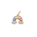 Gold charm in the shape of a rainbow with colorful baguette-cut gemstones forming the arc and pave-set white round diamonds forming two clouds