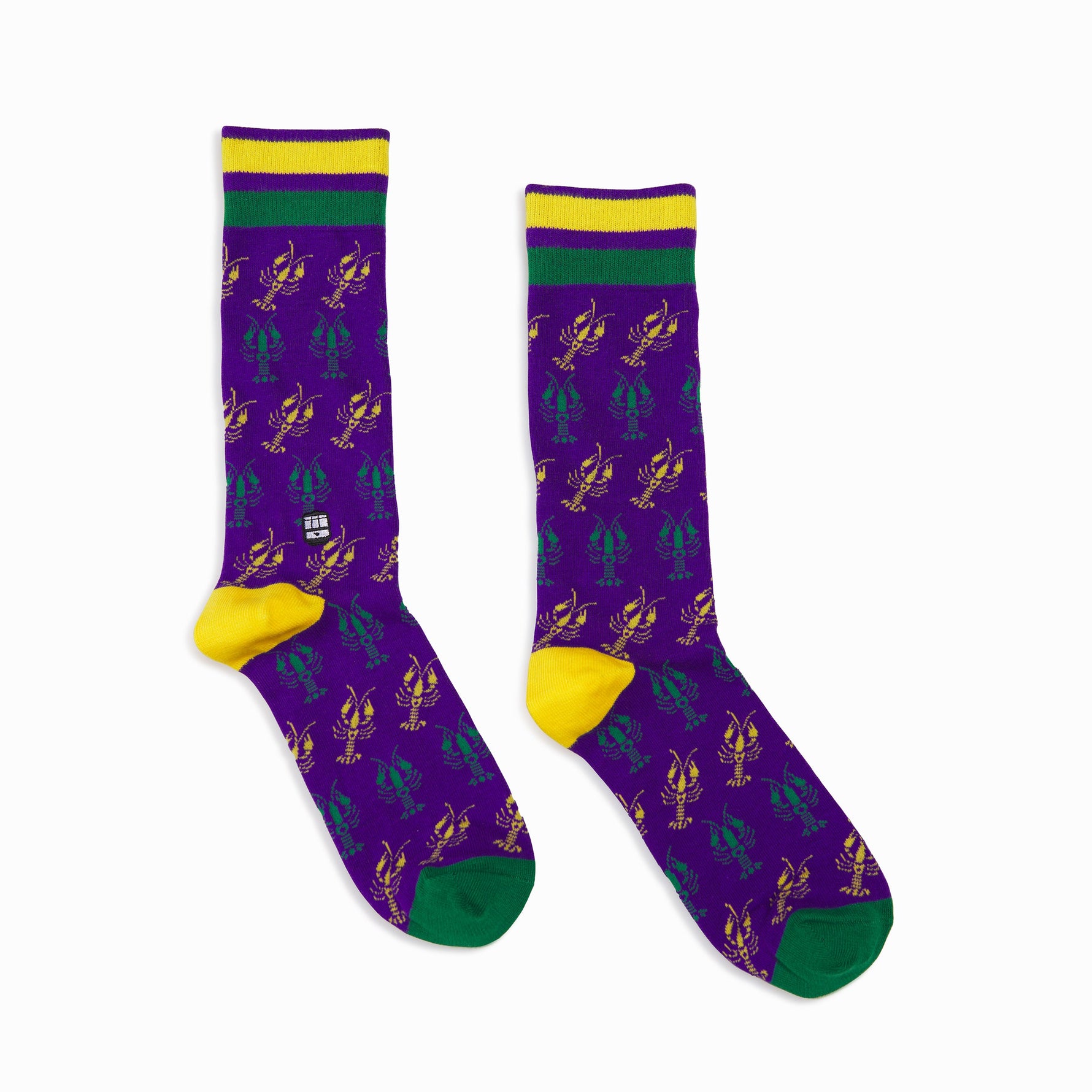 Purple crew socks with yellow and green crawfish pattern and striped cuffs