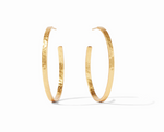 Pair of gold hoop earrings with a hammered texture