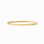 Gold bangle bracelet with evenly spaced round diamonds