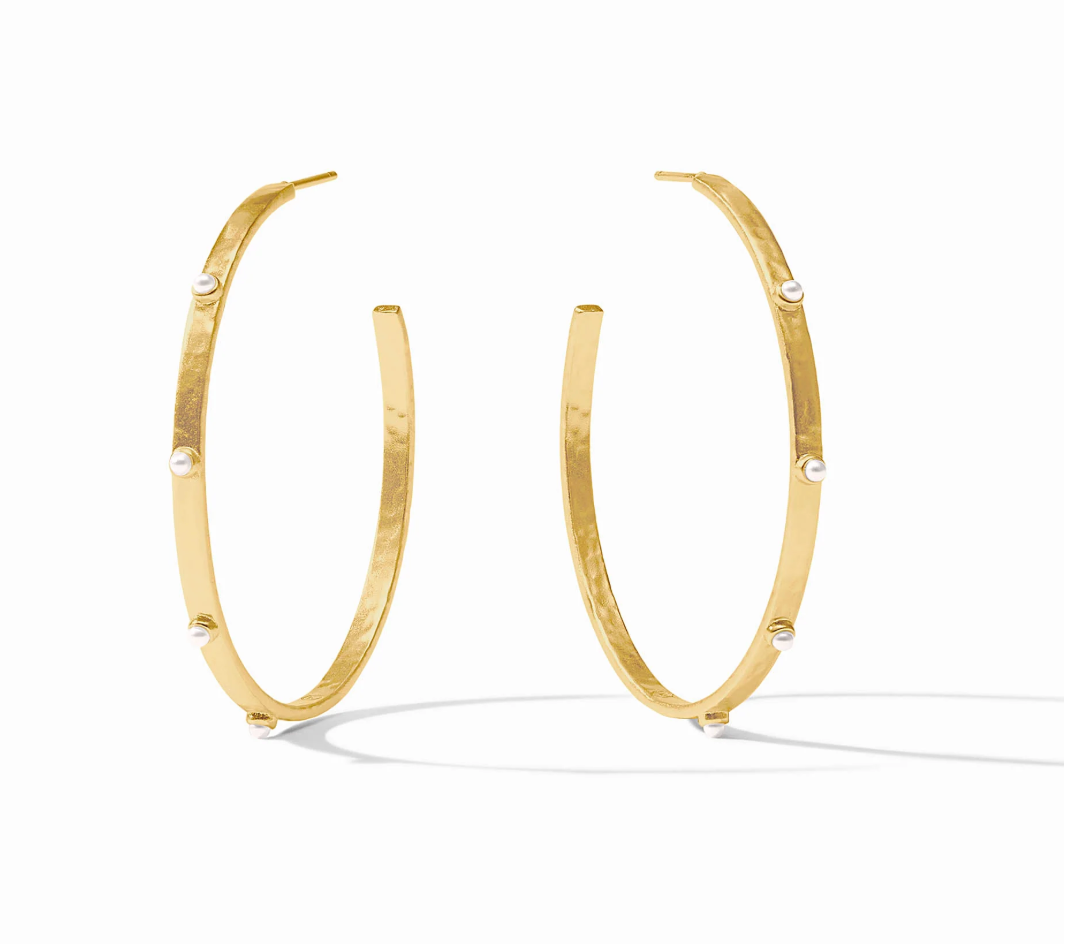Gold hoop earrings with small white pearl accents
