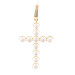 Gold and pearl jewelry cross charm featuring round white pearls individually set in a gold frame with a polished gold bail at the top