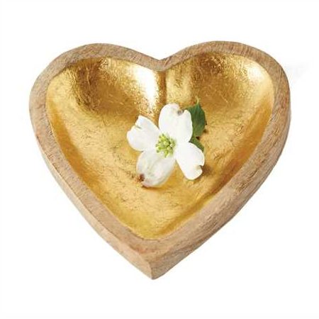 Heart-shaped gold dish with a white flower on a white background