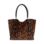 Leopard print tote bag with black leather handles