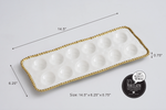 Pampa Bay Porcelain white rectangular deviled egg serving tray featuring twelve round indentations and a decorative gold beaded rim, measuring 14.5 by 6.25 by 0.75 inches