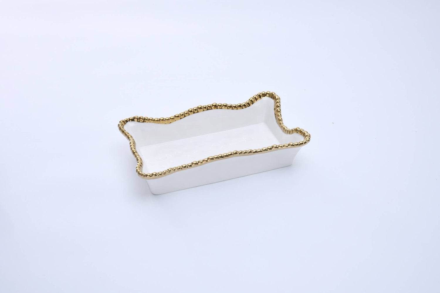 White ceramic rectangular decorative dish with a unique scalloped beaded gold rim and subtle interior embossed pattern