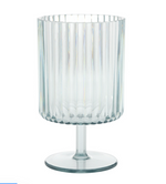 Clear glass goblet with a cylindrical ribbed body, short stem, and flat round base