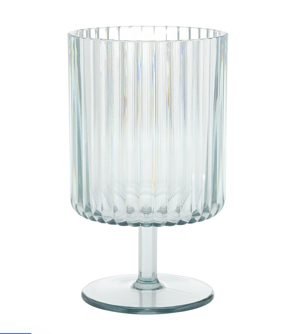 Clear glass goblet with a cylindrical ribbed body, short stem, and flat round base