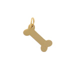 Gold charm featuring a polished bone-shaped pendant with a small jump ring isolated on a white background