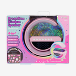 Hot Focus DreamGlow Wireless Speaker, a multi-function device in vibrant pink and purple retail packaging, featuring a holographic glitter panel, sleek curved design, and glow-in-the-dark stickers
