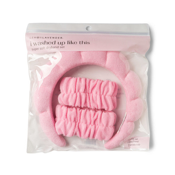 Product photo by Lemon Lavender of a bright pink super soft dryband set featuring a puffy terry cloth headband and two matching wristbands in clear packaging with the phrase I washed up like this