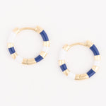Gold and enamel hoop earrings featuring a nautical-inspired navy blue and white striped pattern