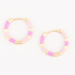 Pair of gold and enamel hoop earrings featuring alternating light pink and lilac striped segments