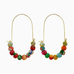 A pair of gold-tone wire earrings featuring a vibrant arc of unique multicolored fabric-wrapped beads
