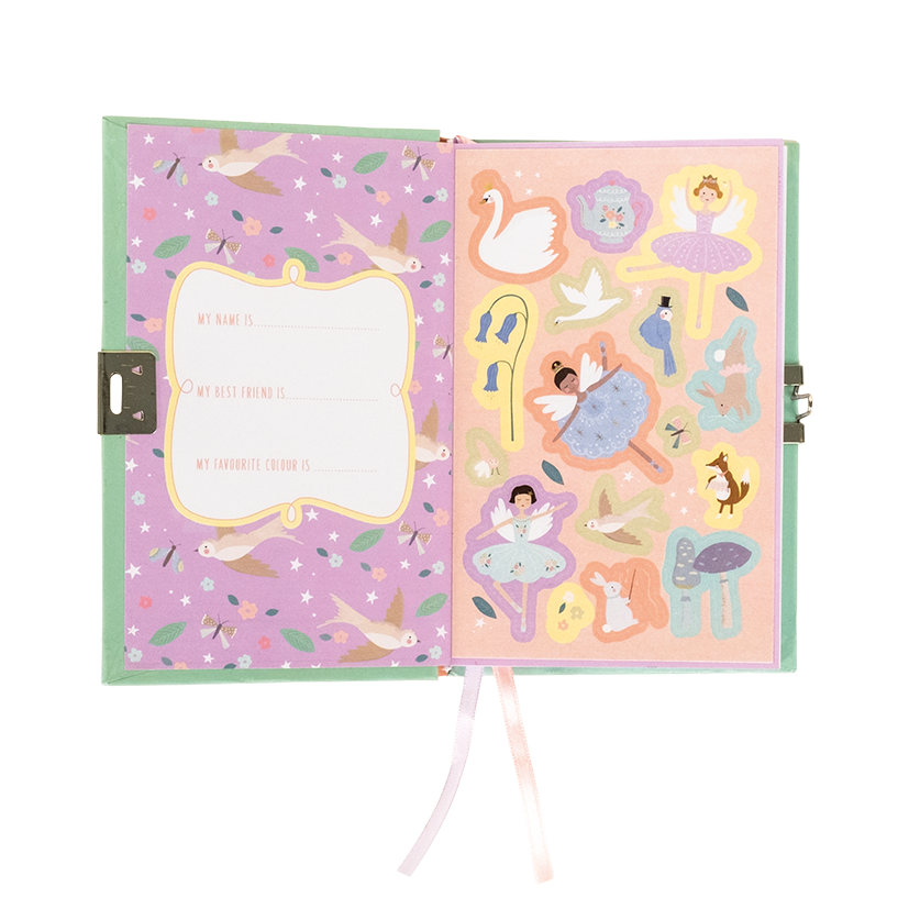 Whimsical children's diary open to reveal a lavender left page with a 'My name is' prompt and flying birds, opposite a peach right page adorned with die-cut stickers of ballerinas, a swan, and a fox