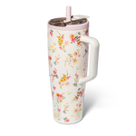 Cream colored tumbler with floral pattern and handle