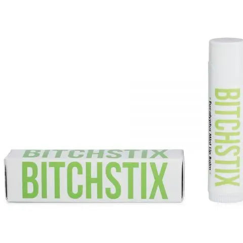 Commercial product photography for Bitchstix featuring an Eucalyptus Mint Lip Balm tube and rectangular box on a white background with bold lime green block lettering and a minimalist matte finish