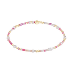 Jewelry delicate beaded bracelet featuring polished gold beads, luminous white freshwater pearls, and a captivating mix of vibrant fuchsia and translucent seed beads