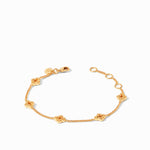 Gold chain bracelet with four clover shaped charms