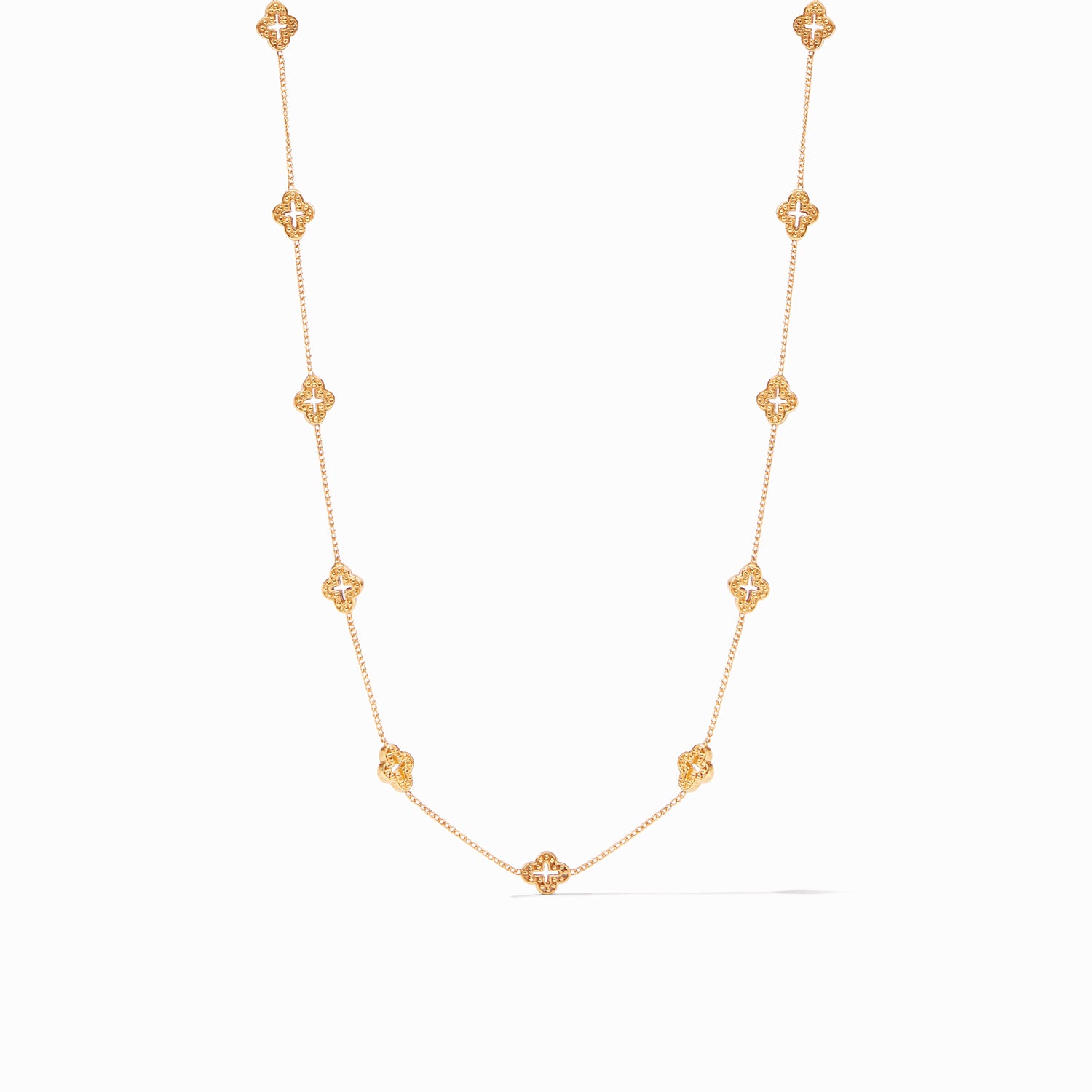 Gold chain necklace featuring nine evenly spaced clover shaped charms