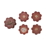 Set of four flower shaped red resin coasters with gold leaf accents