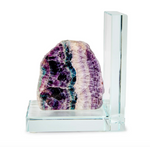 Polished fluorite crystal sculpture on a clear L-shaped glass stand featuring vibrant layers of deep purple and teal green minerals with a translucent white crystalline texture