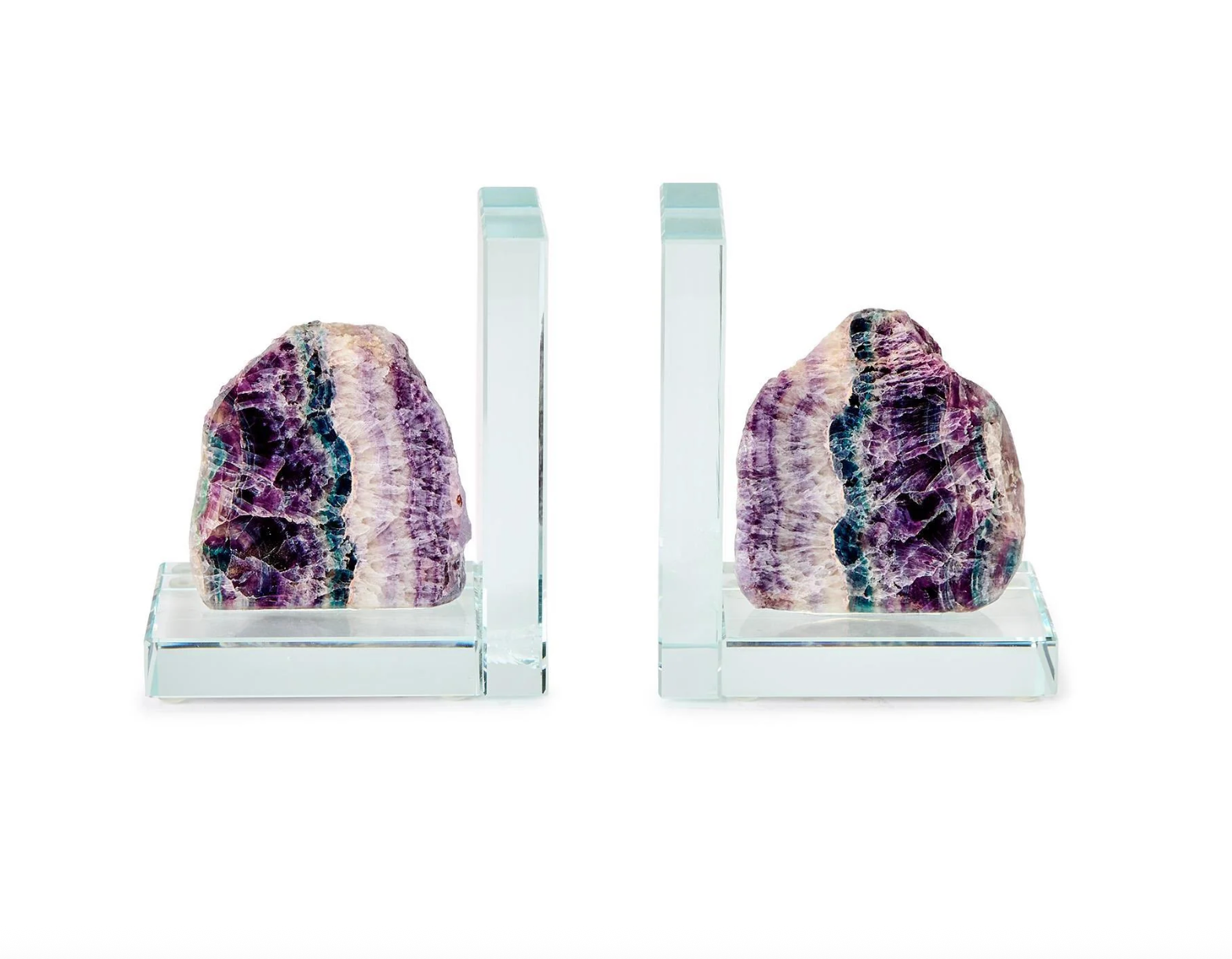 Fluorite and glass bookends featuring raw mineral specimens with vibrant purple and teal crystalline banding mounted on polished clear L-shaped supports against a white background