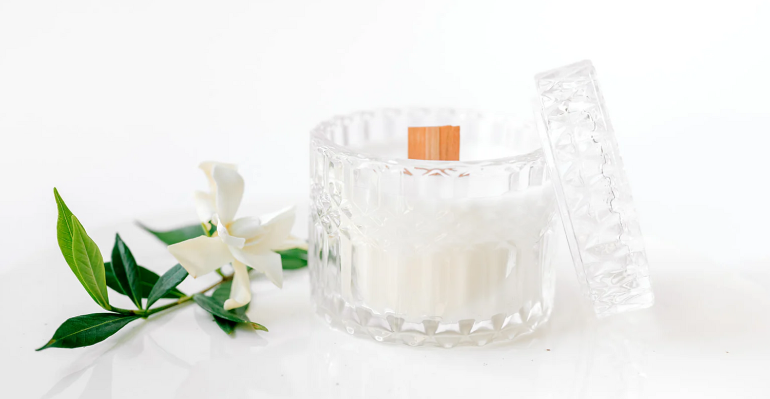 Crystal glass candle jar with wooden wick and white gardenia flower