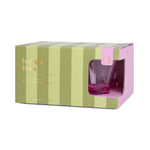 Here's How The Gilda Riviera Tumblers product packaging a box with alternating dark and light green vertical stripes and pink side panels displaying two vibrant fuchsia tumblers through a cutout window with gold text branding