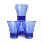 Four translucent cobalt blue glasses stacked in a pyramid formation against a white background, showcasing their tapering sides and reflective light on thick bases