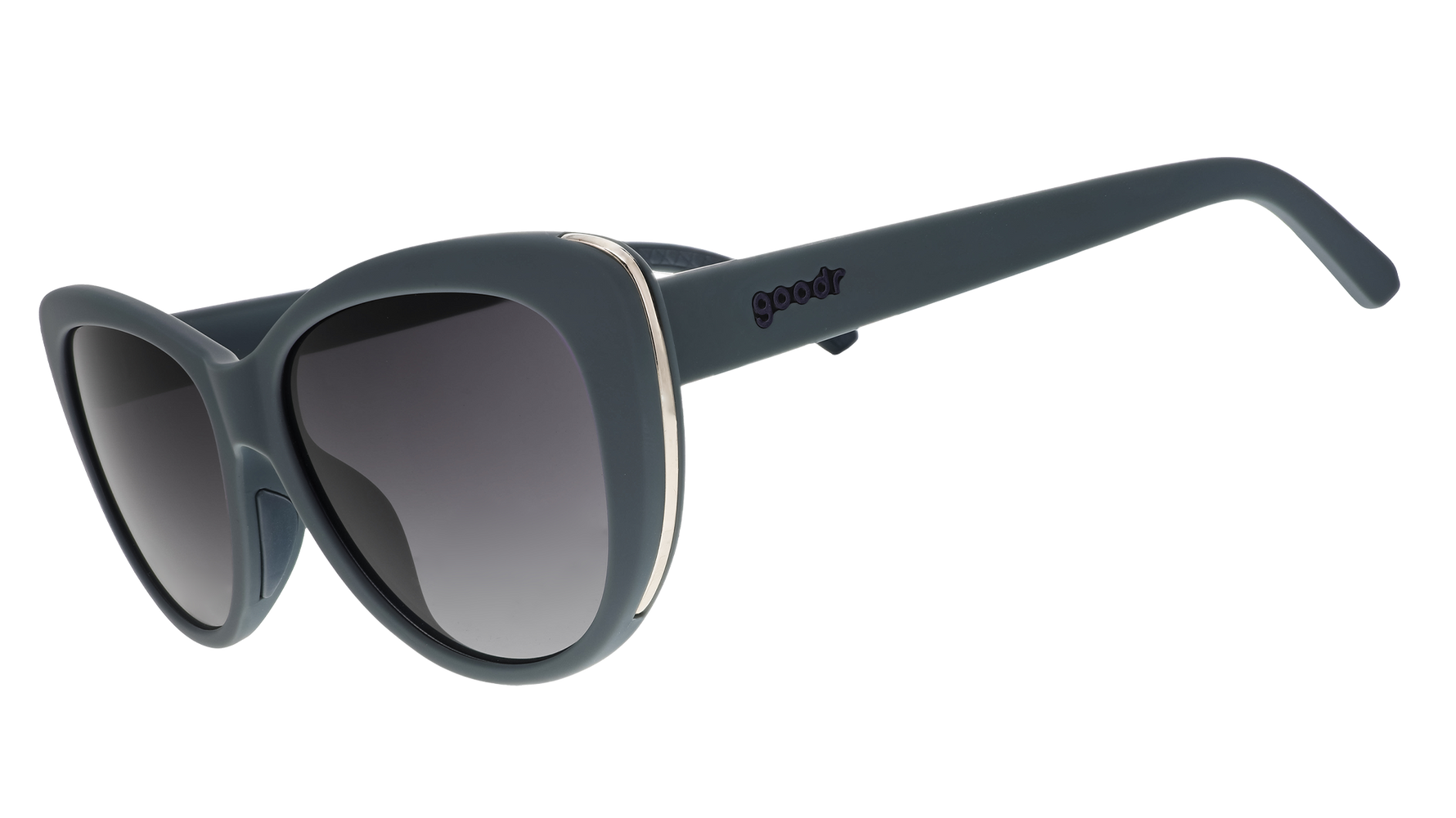 Product photography of goodr slate blue oversized cat-eye sunglasses with gold trim, gradient grey polarized lenses, and the goodr logo on the temple