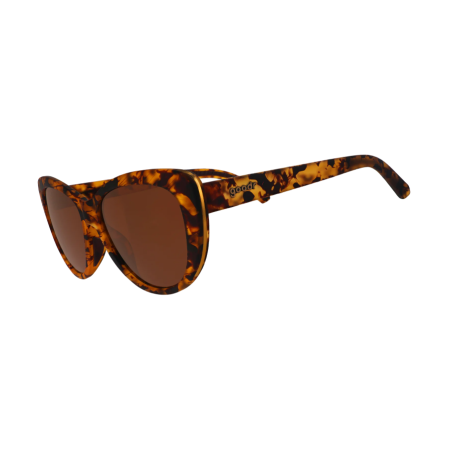 Goodr tortoiseshell cat-eye sunglasses with brown polarized lenses, thin gold trim, and the Goodr logo on the temple