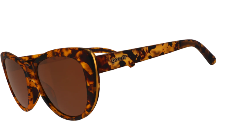 Goodr tortoiseshell cat-eye sunglasses with brown polarized lenses, thin gold trim, and the Goodr logo on the temple