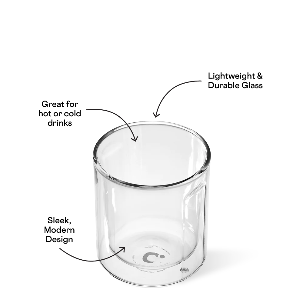 A clear double-walled glass cup featuring a sleek modern design and a C logo on its inner base, presented on a white background with annotations highlighting its lightweight durability and suitability for hot or cold beverages