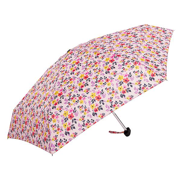 A compact umbrella featuring a light pink background with a vibrant all-over floral pattern of small red, yellow, and purple flowers with green leaves