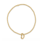 Gold beaded stretch bracelet with a heart charm