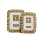 Two gold beaded rectangular picture frames of different sizes