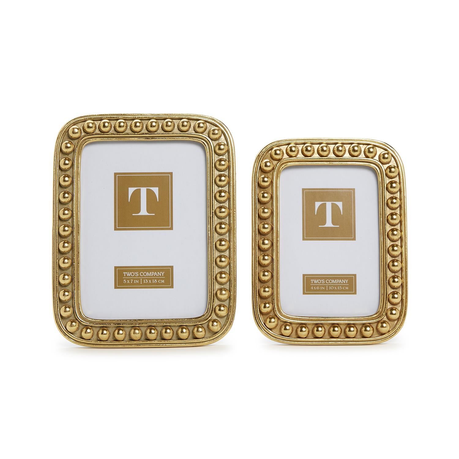 Two rectangular gold picture frames with beaded border detail