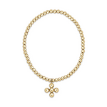 A gold beaded bracelet featuring uniform small polished beads and a distinctive cross pendant composed of five gleaming gold spheres on a white background