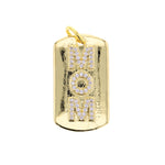 Gold-tone dog tag pendant featuring MOM spelled vertically in pavé-set clear cubic zirconia on a white background