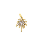 Gold palm tree charm pendant featuring sparkling clear crystals on its fronds and a textured trunk design
